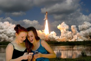 Two young girls disregard the final space shuttle launch at Cape Canaveral, Fla.